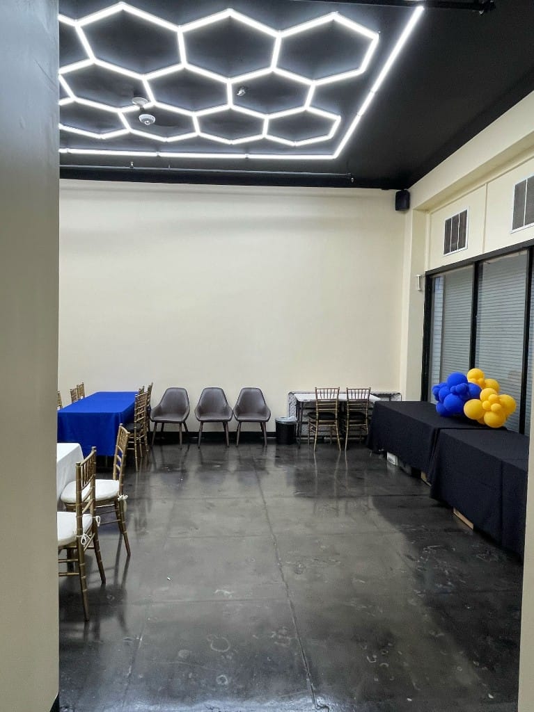 Private dining room with gold chiavari chairs and table linens