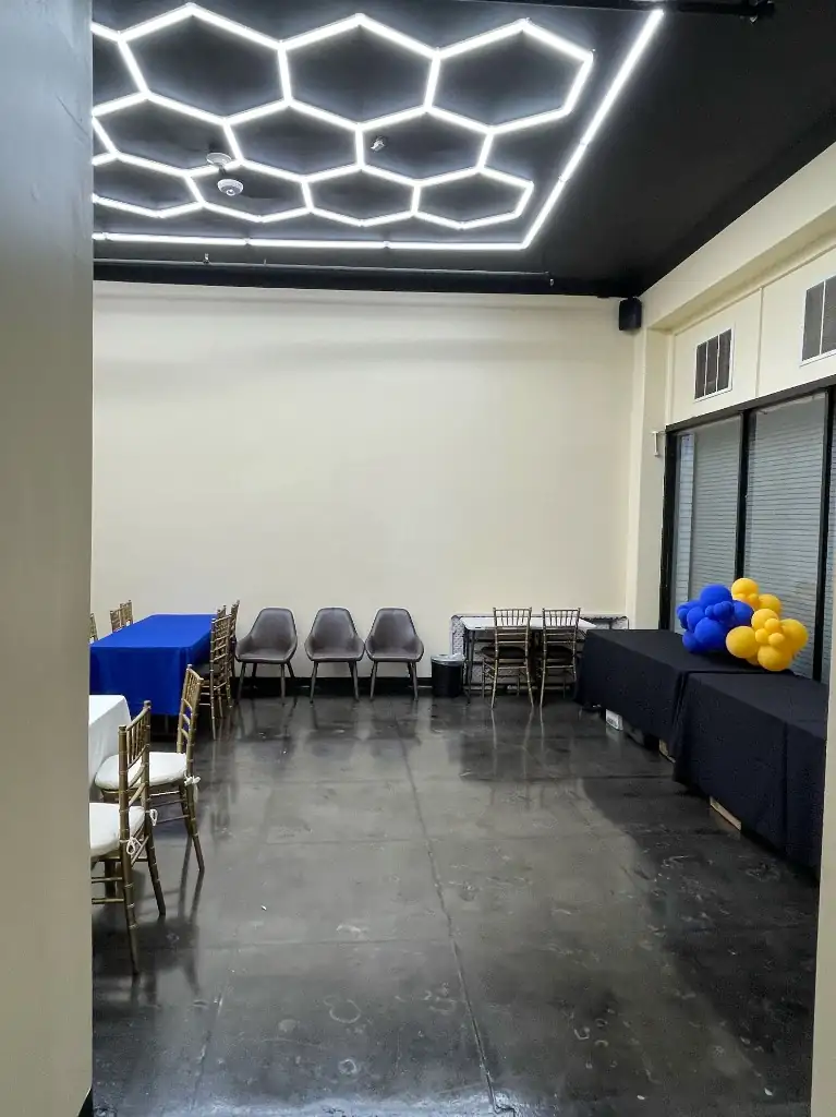 Private dining room with gold chiavari chairs and table linens