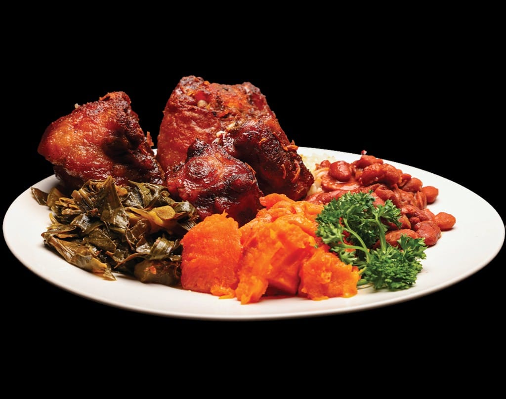Slow-braised oxtail dinner with collard greens, candied yams, and red beans at Lonell's Soul Food
