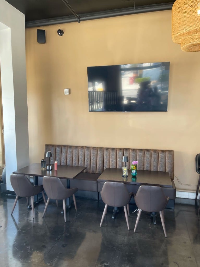 Booth seating with leather banquette and table lamps