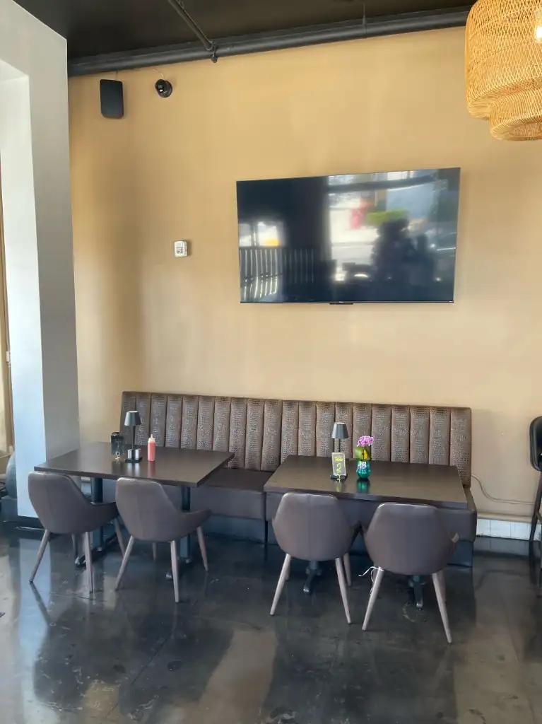 Booth seating with leather banquette and table lamps